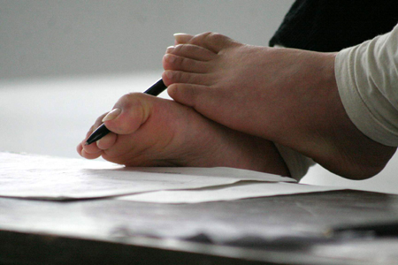 Handicapped woman logs her life by feet