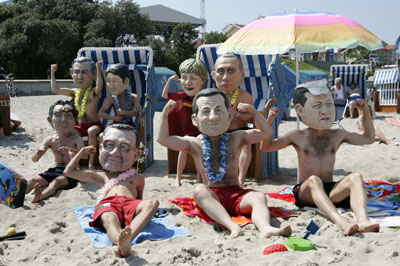 G8 'heads' gather on beach