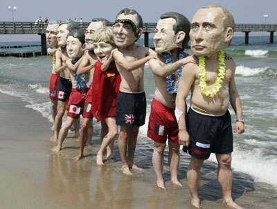 G8 'heads' gather on beach