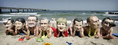 G8 'heads' gather on beach