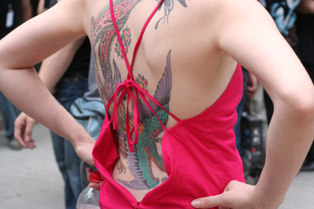 A girl shows her tattoos during the Tattoo Show Convention China 2007 in
