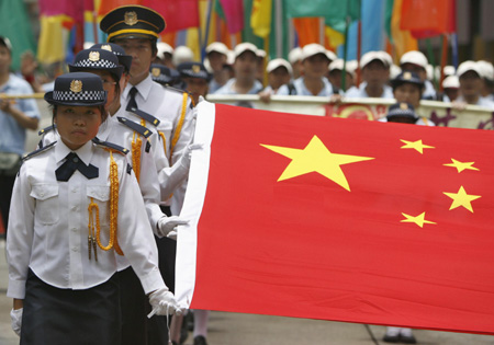 Paraders mark anniversary of Hong Kong's return