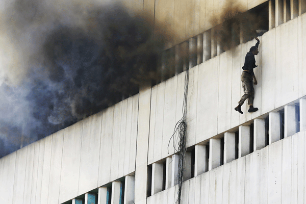 Men fall from building inferno