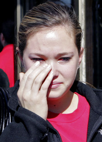 NIU student Cassidy Smith, 20, leaves a memorial service for the victims of the Northern Illinois University shooting at the Newman Catholic Student Center in DeKalb, Illinois February 15, 2008. Former student Stephen Kazmierczak, 27, killed five students and himself and wounded 21 others during a lecture at the university on February 14. [Agencies]