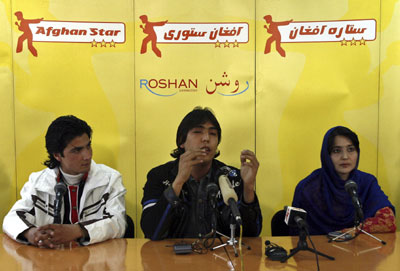 Lima Sahar (R), Hameed Sakhizada (C) and Rafay Nabzada, the three finalists in Afghan Star, Afghanistan's answer to Pop Idol, talk during a news conference in Kabul March 11, 2008. [Agencies]