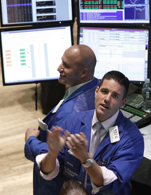 Dow closes above 10,000 for 1st time in a year