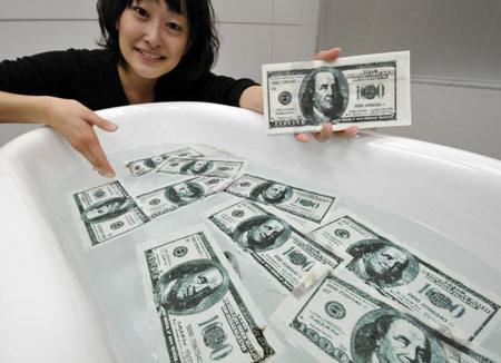 US dollar melts down in Tokyo baths
