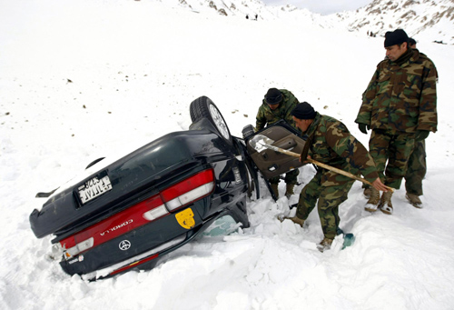 Afghans dig for survivors after avalanches kill 166