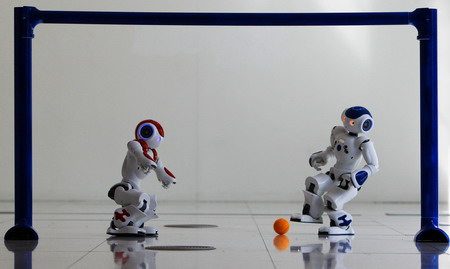 Robots play soccer in scotland