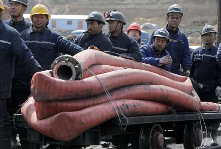 Rescuers race against time for trapped miners