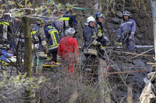Landslide derails train in northern Italy, 9 dead