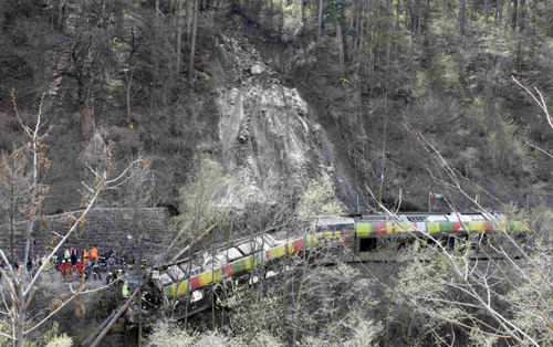 Landslide derails train in northern Italy, 9 dead