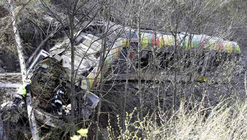 Landslide derails train in northern Italy, 9 dead