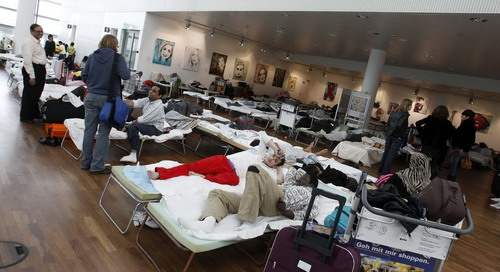 Stranded passengers wait at major Europe airports