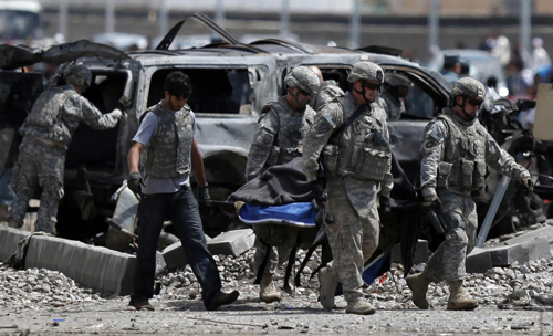 Taliban suicide bomb hits NATO convoy, kills 18