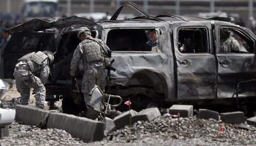 Taliban suicide bomb hits NATO convoy, kills 18