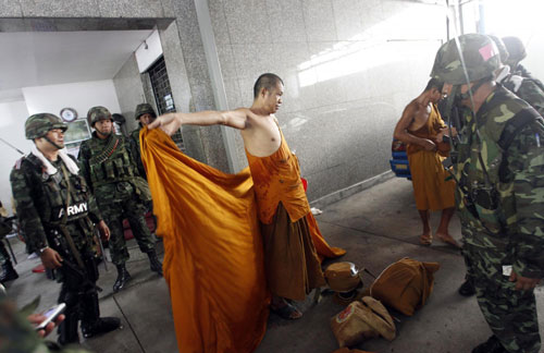 Bangkok burns as protesters surrender