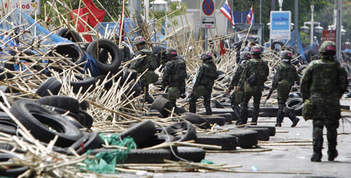 Bangkok burns as protesters surrender