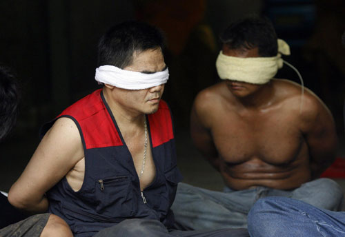 Bangkok burns as protesters surrender