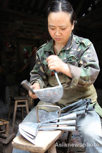 Husband-wife team work together as blacksmiths