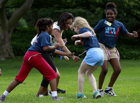 US first lady plays with children to promote physical activity