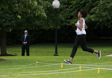 US first lady plays with children to promote physical activity