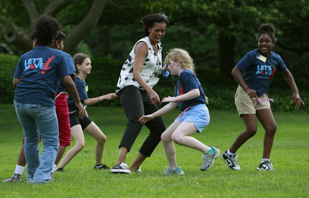 US first lady plays with children to promote physical activity
