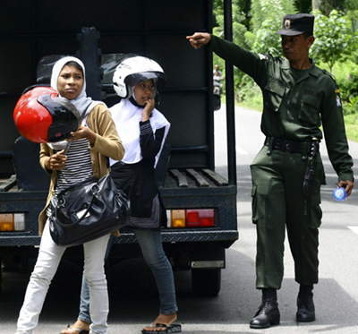 Women caught wearing tight pants given skirt in Aceh