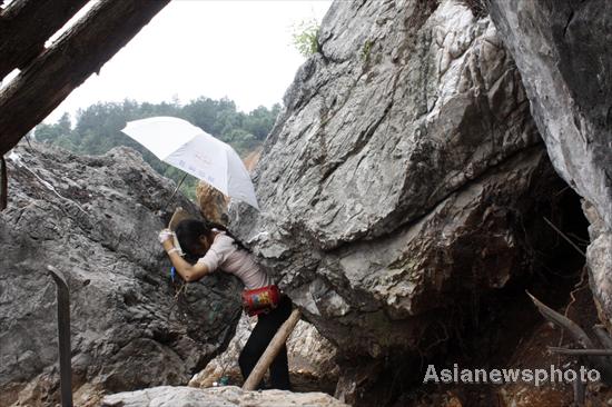 Woman dies after getting stuck in rocks