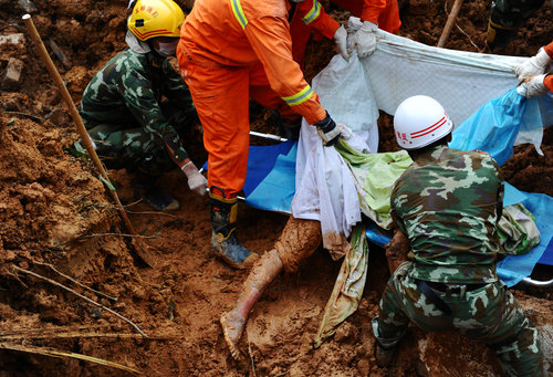 Grim task uncovers bodies after landslide