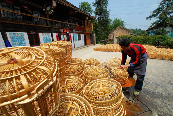 Bird cages support whole Miao village