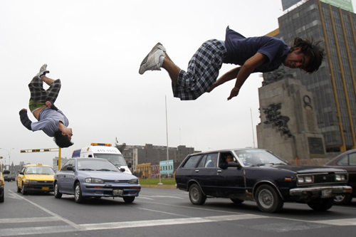 Young men play stunt to get tips from drivers