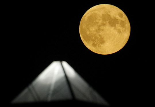 Moon above pyramid at the Glastonbury Festival 2010
