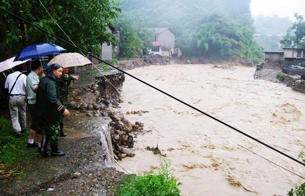 Floods leave 13 dead, 23 missing in SW China