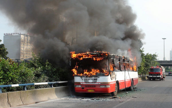 Bus engulfed in flames after refueling in SW China