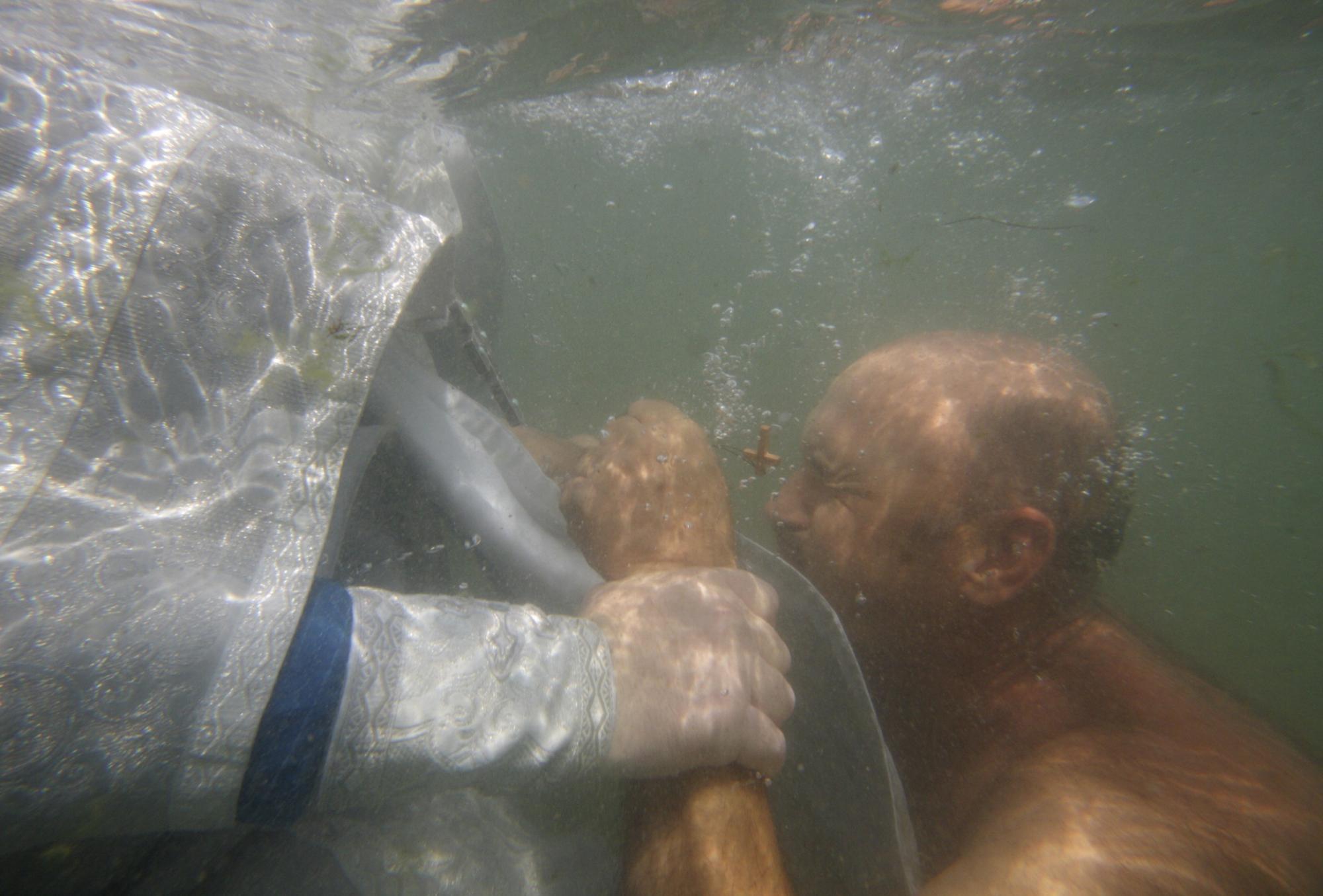 Baptizing to mark Christianity conversion