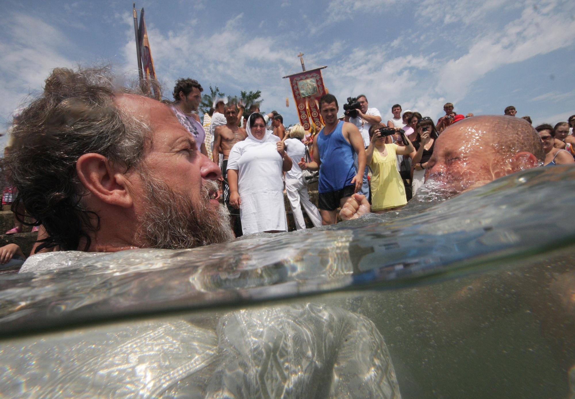 Baptizing to mark Christianity conversion