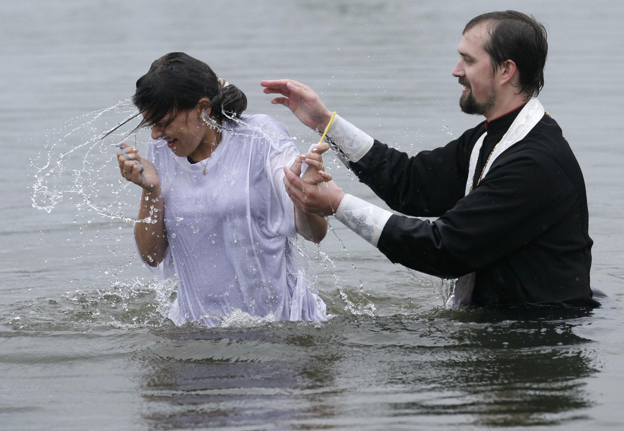 Baptizing to mark Christianity conversion