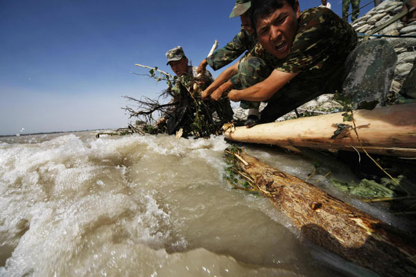 Ongoing efforts to strengthen breached dyke