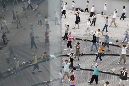 Group Tai Chi practice in downtown Tokyo