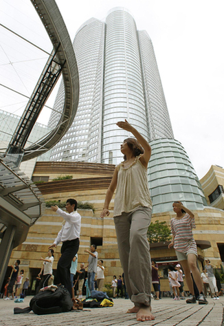 Group Tai Chi practice in downtown Tokyo