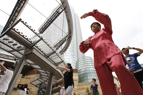 Group Tai Chi practice in downtown Tokyo