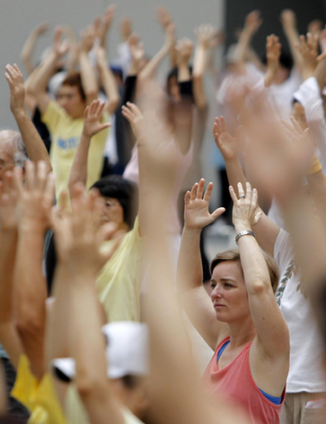 Group Tai Chi practice in downtown Tokyo