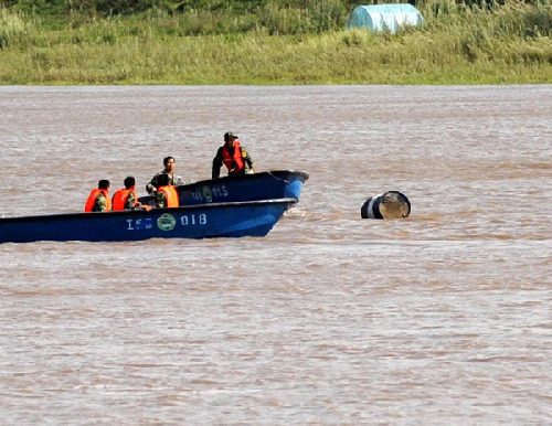 Most chemical barrels recovered from river
