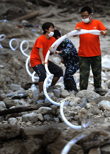 Temporary pipes bring water to disaster victims