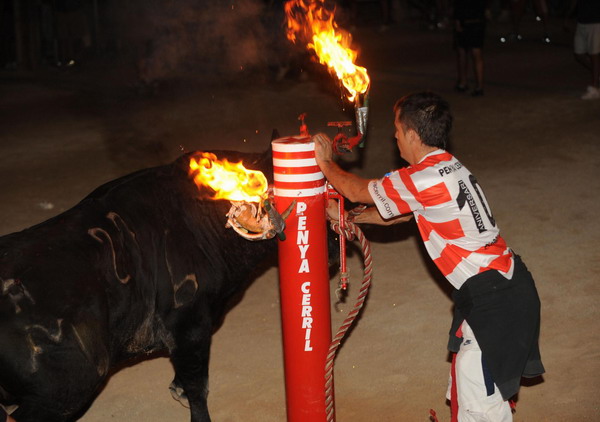 Flaming bulls light up the night in Spain