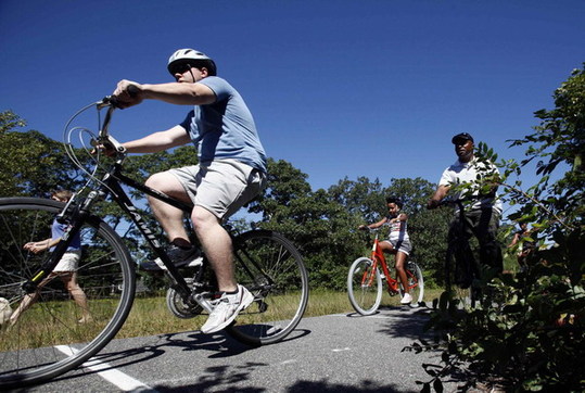 First family goes on island vacation bike outing