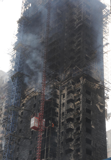 Unfinished high rise catches fire in NE China