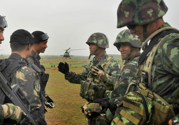 Soldiers rope down from helicoper in joint drill