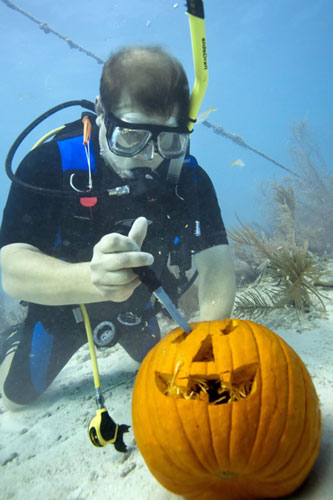 Carving Jack-o-Lanterns underwater